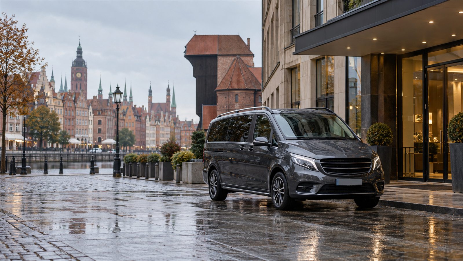 Private airport transfer minivan outside a Gdansk Old Town hotel